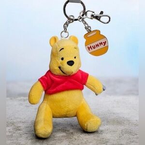 Winnie The Pooh Disney Keychain in yellow with red shirt and honey pot Brand new